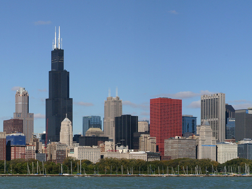 A partial view of the Chicago skyline seen from the water on a sunny day