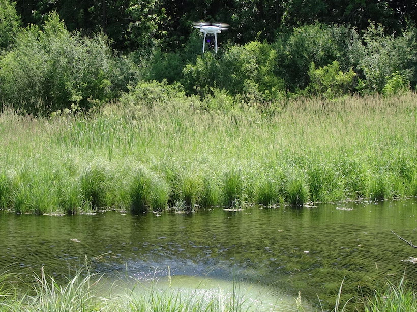 A drone hovers over a spring in Fitchburg, Wis.