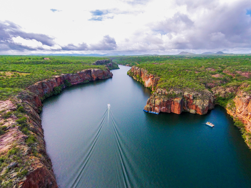 Aerial photo of a single boat making its way on Brazil’s São Francisco River