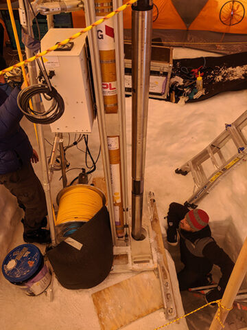 Joey Palmowski of Honeybee Robotics (the company that built the drill) watches as the WATSON instrument, attached to the drill, is lowered into a borehole Joey Palmowski of Honeybee Robotics (the company that built the drill) watches as the WATSON in-strument, attached to the drill, is lowered into a borehole