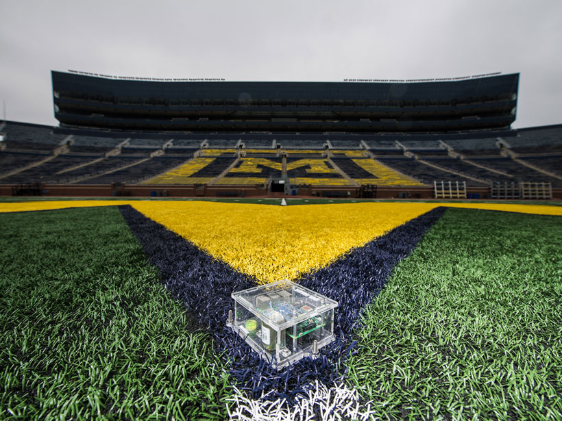 A Raspberry Shake seismograph on an empty University of Michigan field