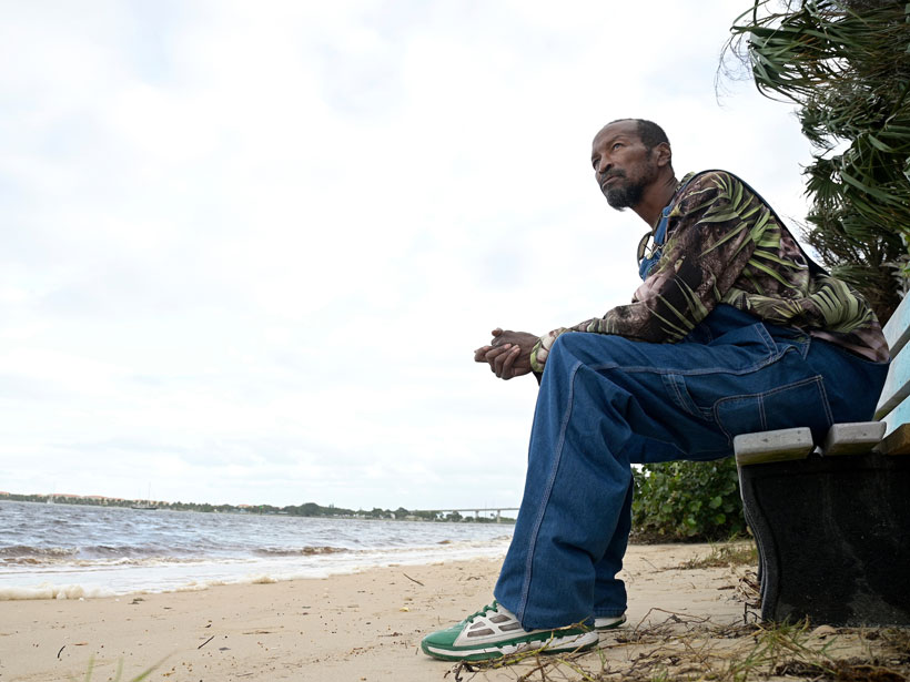 Gerald Newberry sits on a bench at the waterfront next to the Port of Fort Pierce, Fla. Gerald Newberry sits on a bench at the waterfront next to the Port of Fort Pierce, Fla.