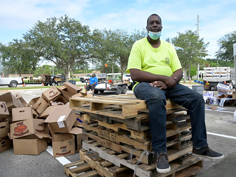 Mario Wilcox takes a break after volunteering at a community food giveaway in Fort Pierce, Fla. Mario Wilcox takes a break after volunteering at a community food giveaway in Fort Pierce, Fla.