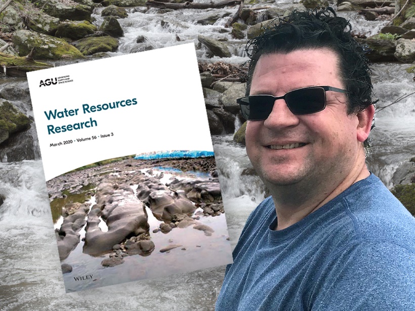 A photograph of Martyn Clark with a cover of Water Resources Research.