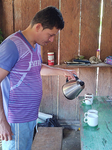 Farmer pours coffee in Serranía de San Lucas in northern Colombia.