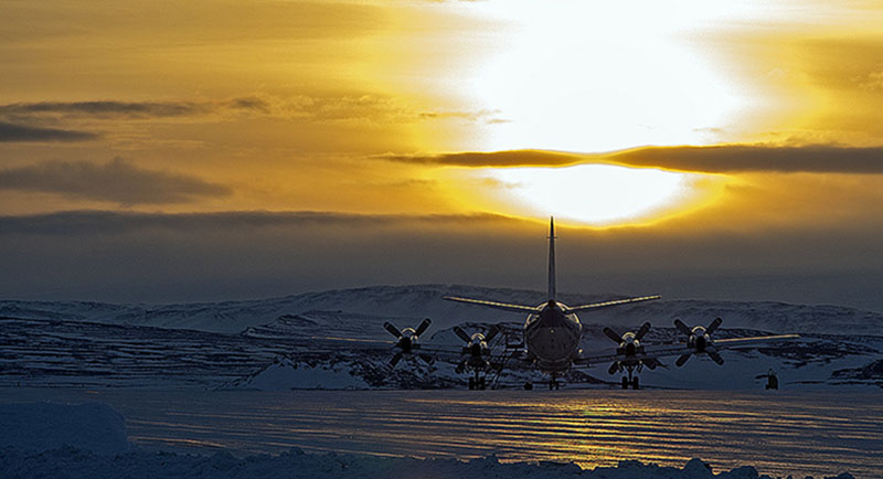 Photograph of aircraft on the ground at sunrise in Greenland Photograph of aircraft on the ground at sunrise in Greenland