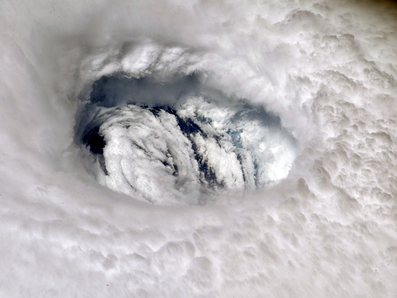 A close-up photograph of the eye of Hurricane Dorian.