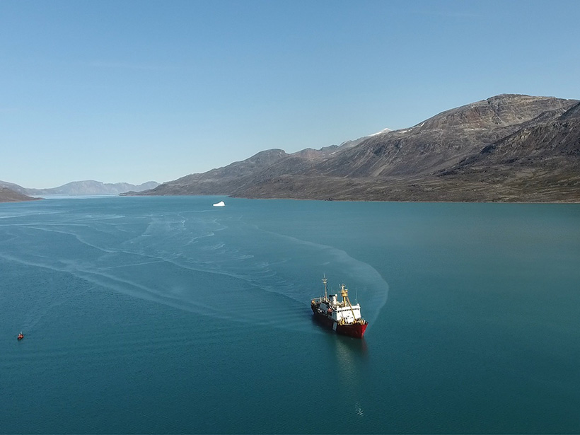 The research vessel CCGS Hudson in Southwind Fjord, Baffin Island, with the iceberg that initiated a submarine landslide in the background.