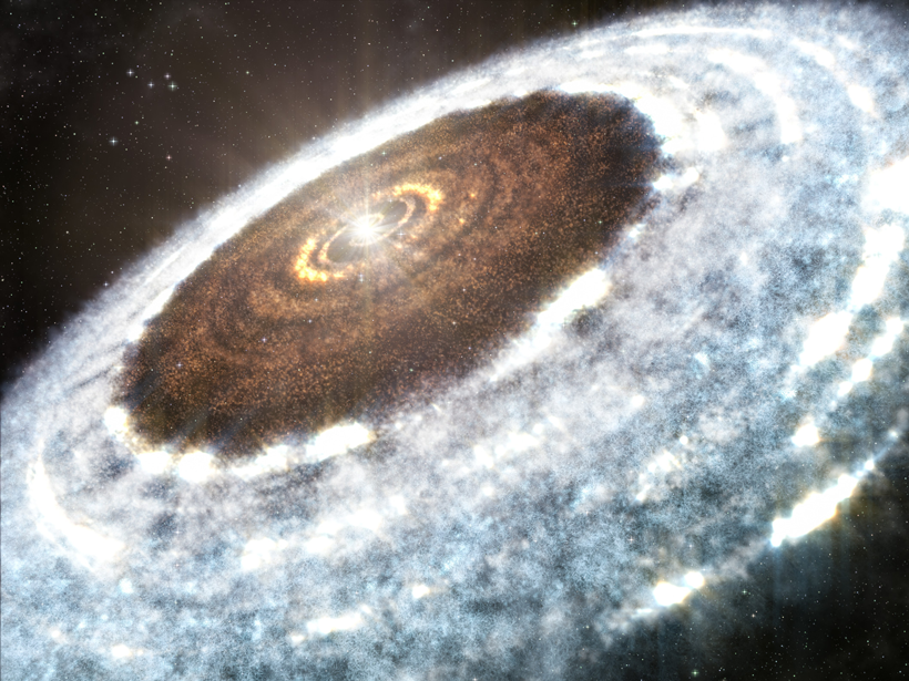 A blue and white disk of dust, gas, and ice swirls around a young star. The inner part of the disk has no ice and glows yellow and red.