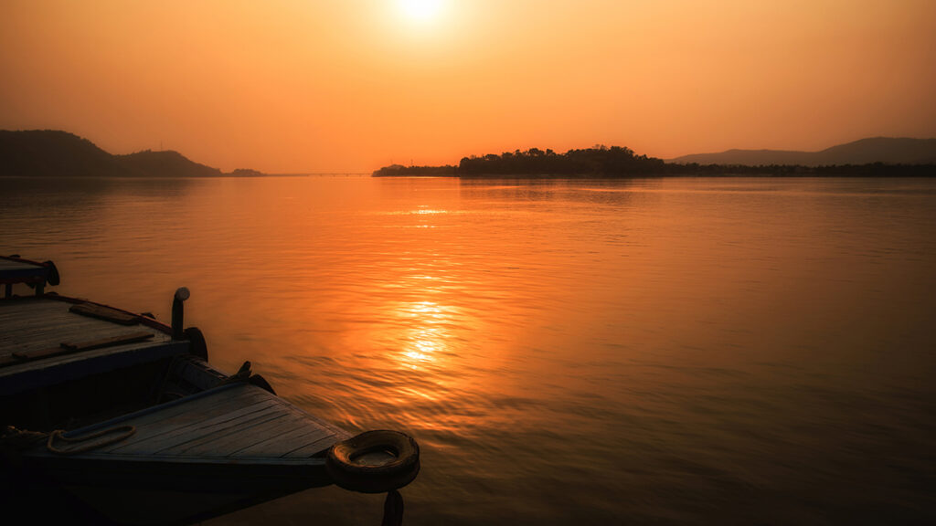 View of the Brahmaputra River with the sun low on the horizon