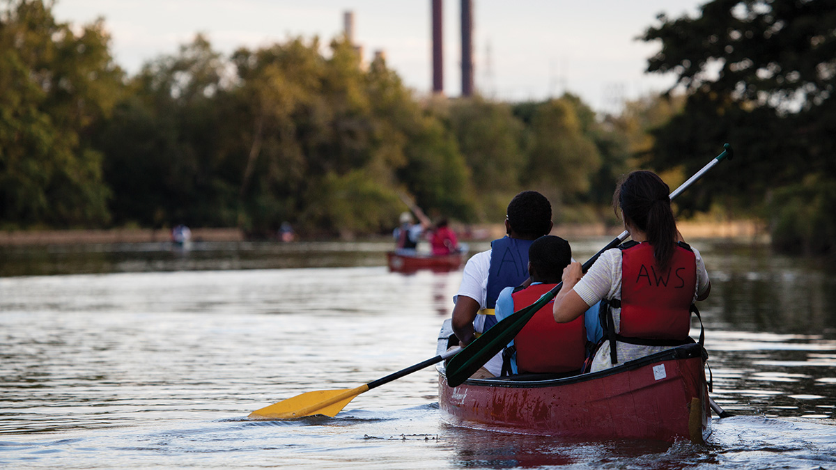 Canoers paddle along the Anacostia near Kenilworth Park in Washington, D.C.