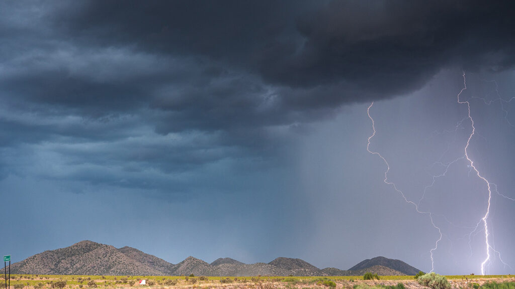 Thunderstorm above an arid southwest landscape