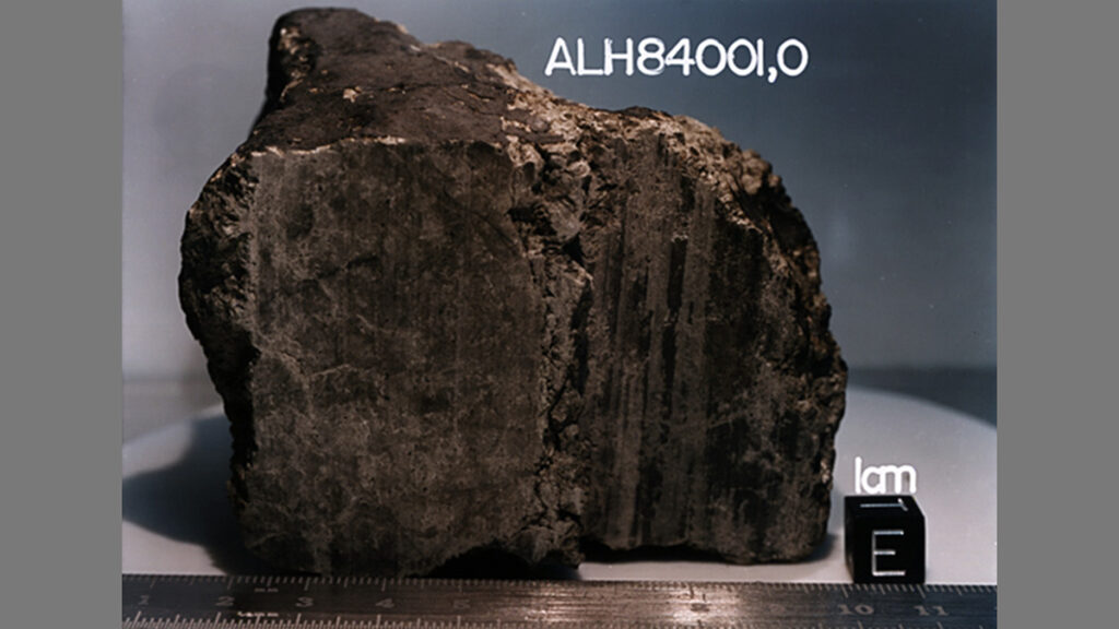 Martian meteorite ALH84001 shown with a 1-centimeter cube for scale