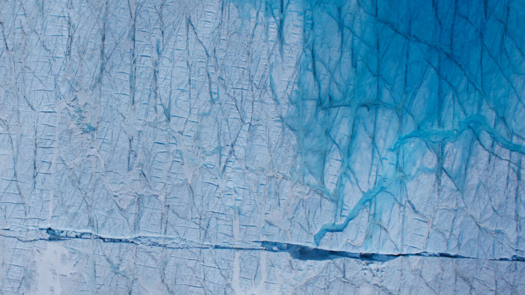 Meltwater draining through a crack in a glacier