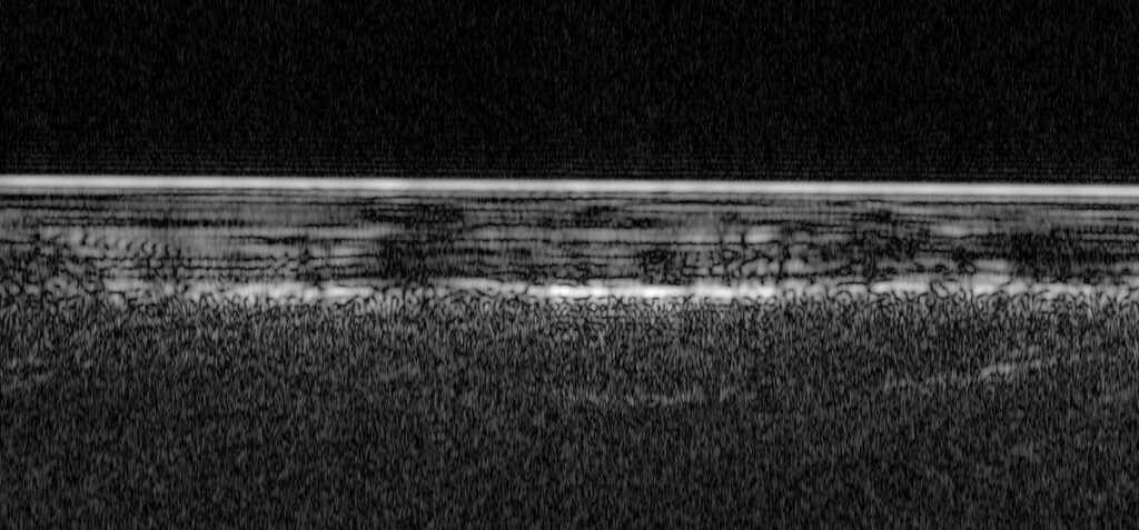 Alternating light and dark bands show layers in the south polar ice cap on Mars.