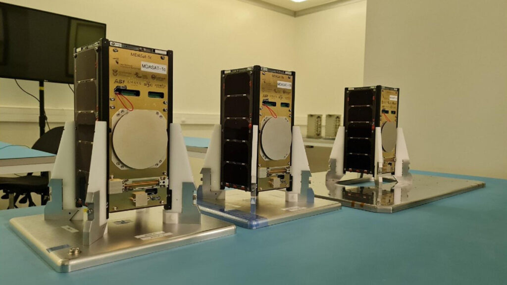 The three CubeSats from the MDASat constellation sit in a clean room at Cape Peninsula University of Technology, Cape Town, South Africa.