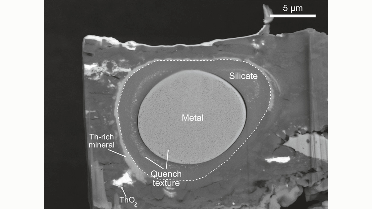 A back-scattered electron image of an experimental charge showing a miniaturized model of the core-mantle boundary equilibrated at pressure-temperature conditions thought to prevail during core formation.