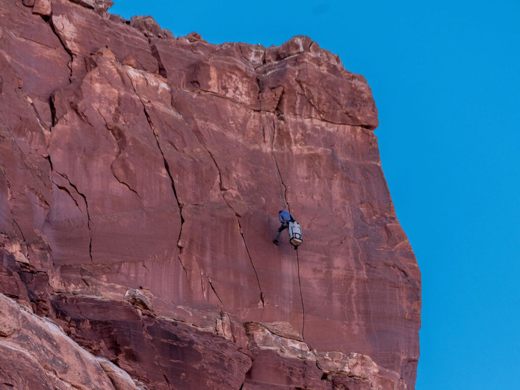Climbers descend the Eagle Plume Tower rock formation.