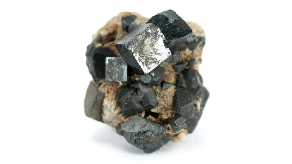 Cubes of gray-black perovskite in a brown matrix