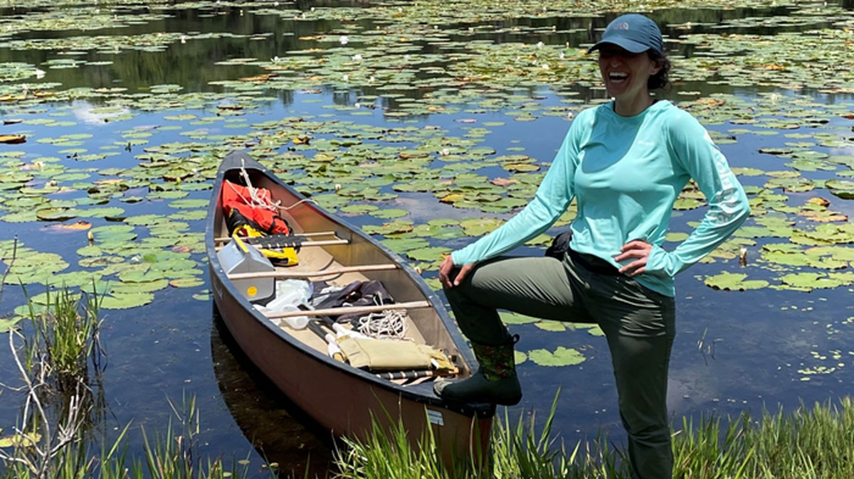 Audrey Goeckner gathering sediment samples from a stormwater pond in Florida.