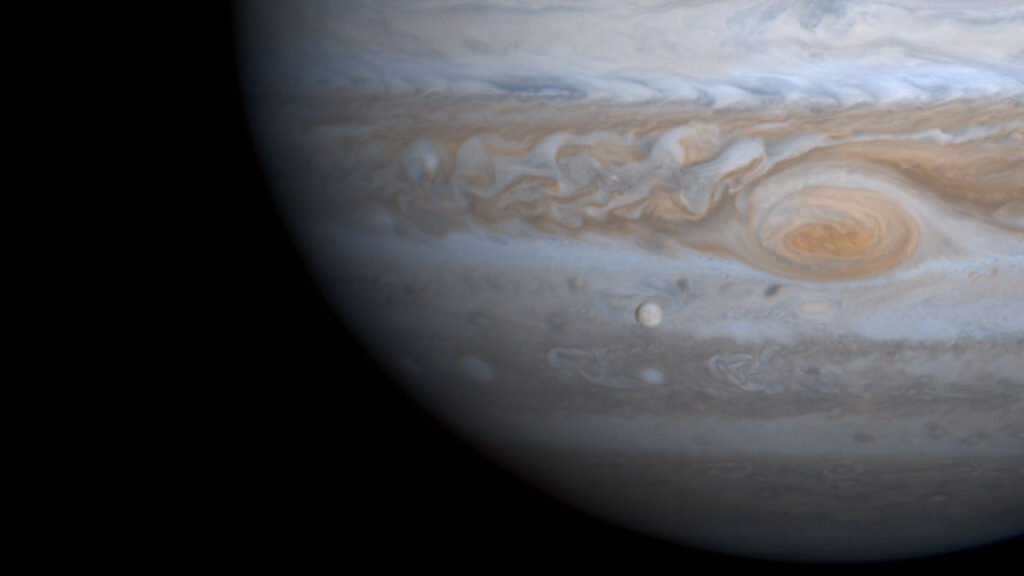 Europa situated in front of Jupiter.