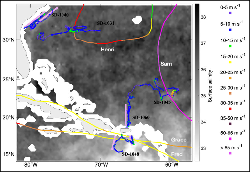 Map of the northern Caribbean and western Atlantic showing saildrone trajectories for the 2021 mission as well as paths of tropical storms and the ocean surface salinity.
