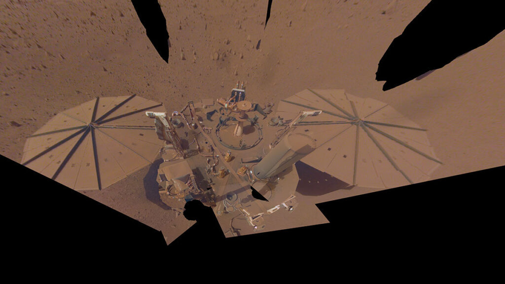 NASA’s InSight lander, covered in dust on Mars