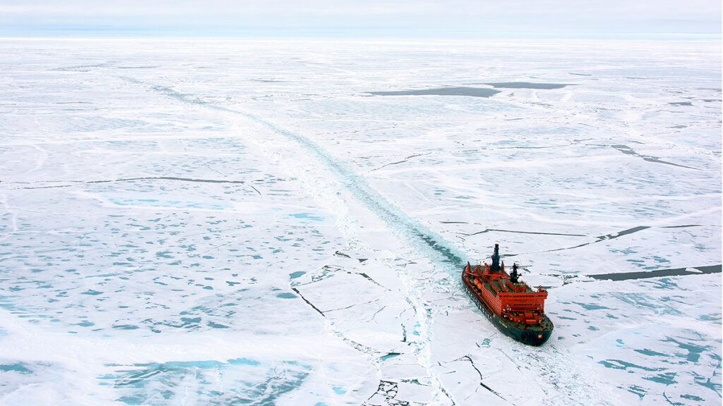 A ship sails through sea ice.