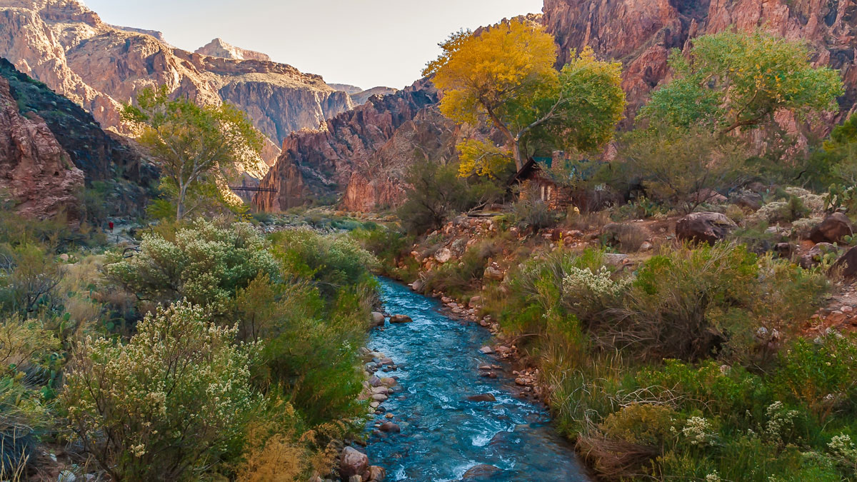 The Colorado River with canyons in the background
