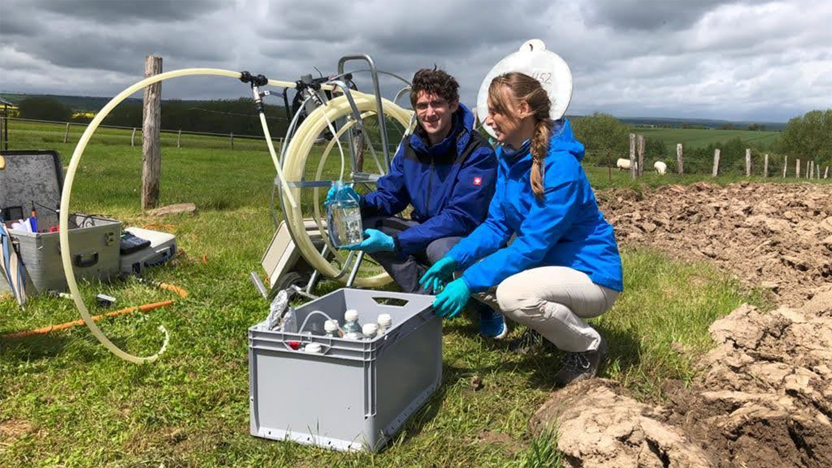 Scientists take groundwater samples at a karst aquifer field site.