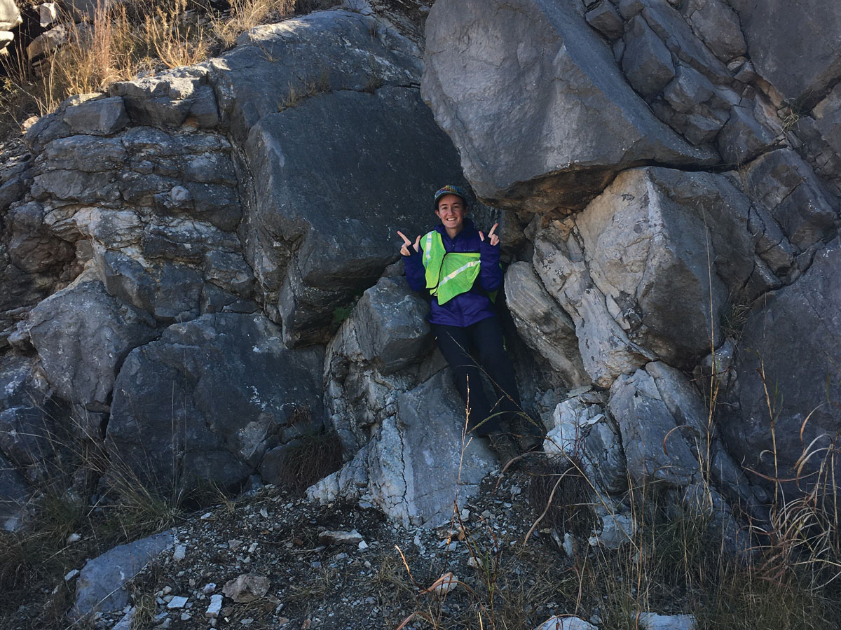 Geologist Lauren Haygood balances on a plunging anticline during a field trip to the Arbuckle Mountains, Okla.