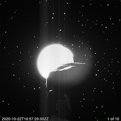 Particles collected from Bennu escape from the sampling device in this image sequence.