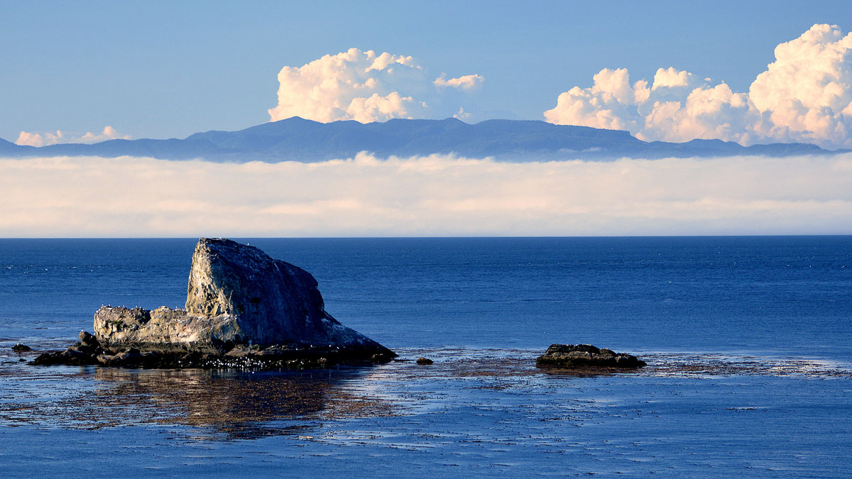 Vancouver Island rising above the Strait of Juan de Fuca.