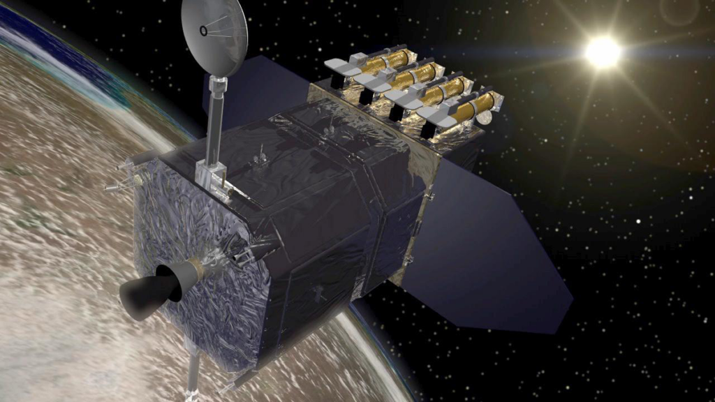 A boxy spacecraft with solar panels and antennas stands above Earth with the Sun in the distance.