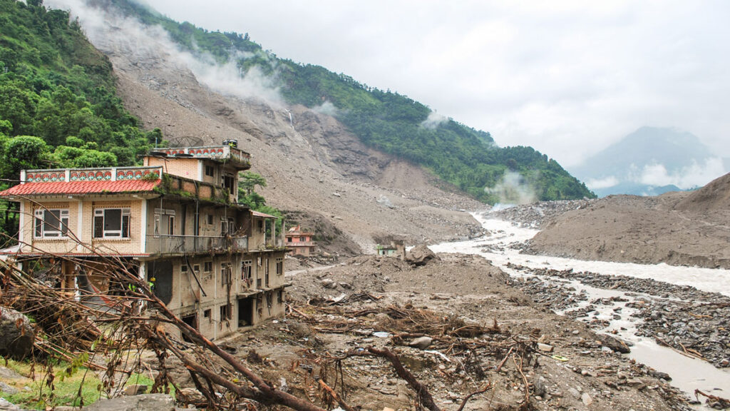 Abandoned buildings sit in the wake of a landslide that hit the Sunkoshi River in Nepal.