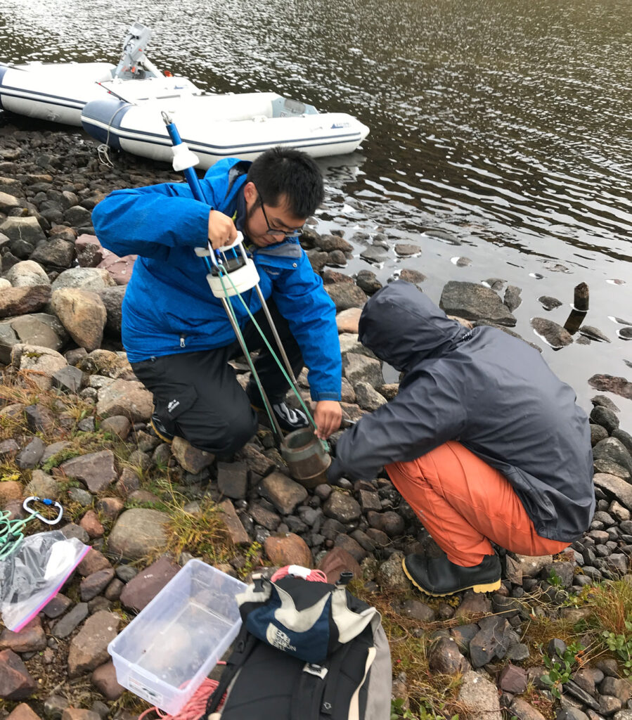 Scientists assemble equipment at a lake in Greenland.