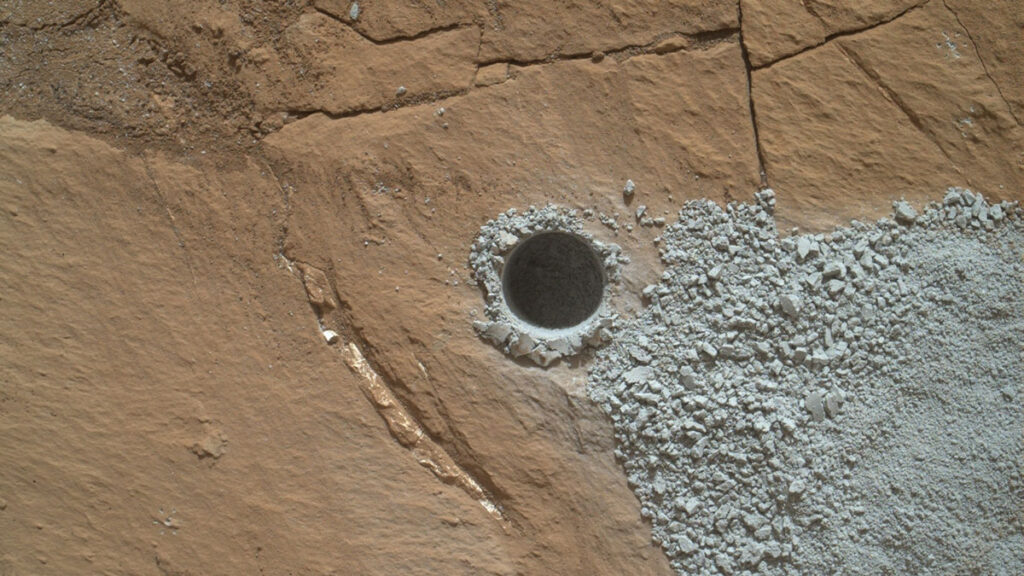 A circular hole drilled into Gale Crater on Mars.
