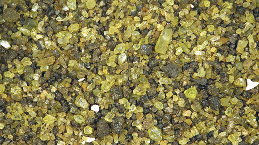 Close-up of green olivine sand grains