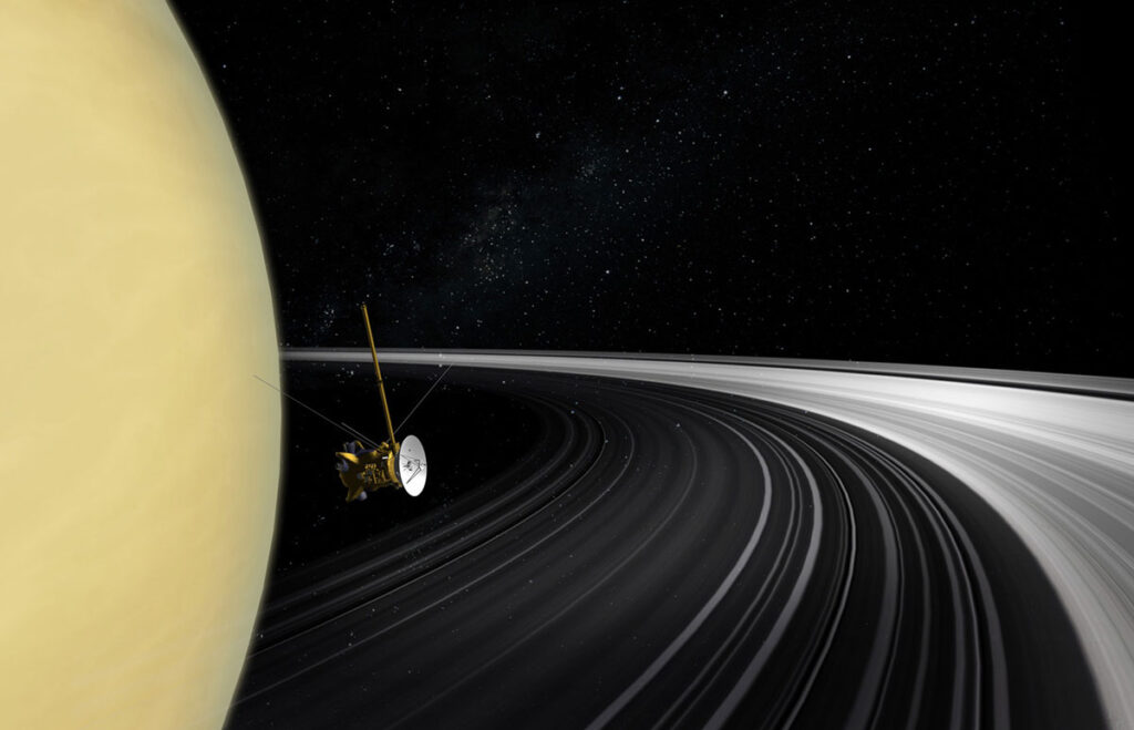 A spacecraft floats between Saturn and its rings.