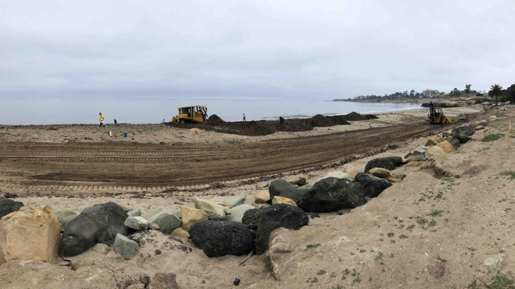 Sandbags of wildfire debris are spread on Goleta Beach, Calif.