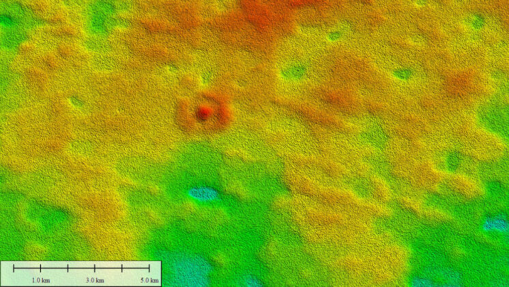A satellite image with false color for elevation reveals a domed, ring-shaped structure.