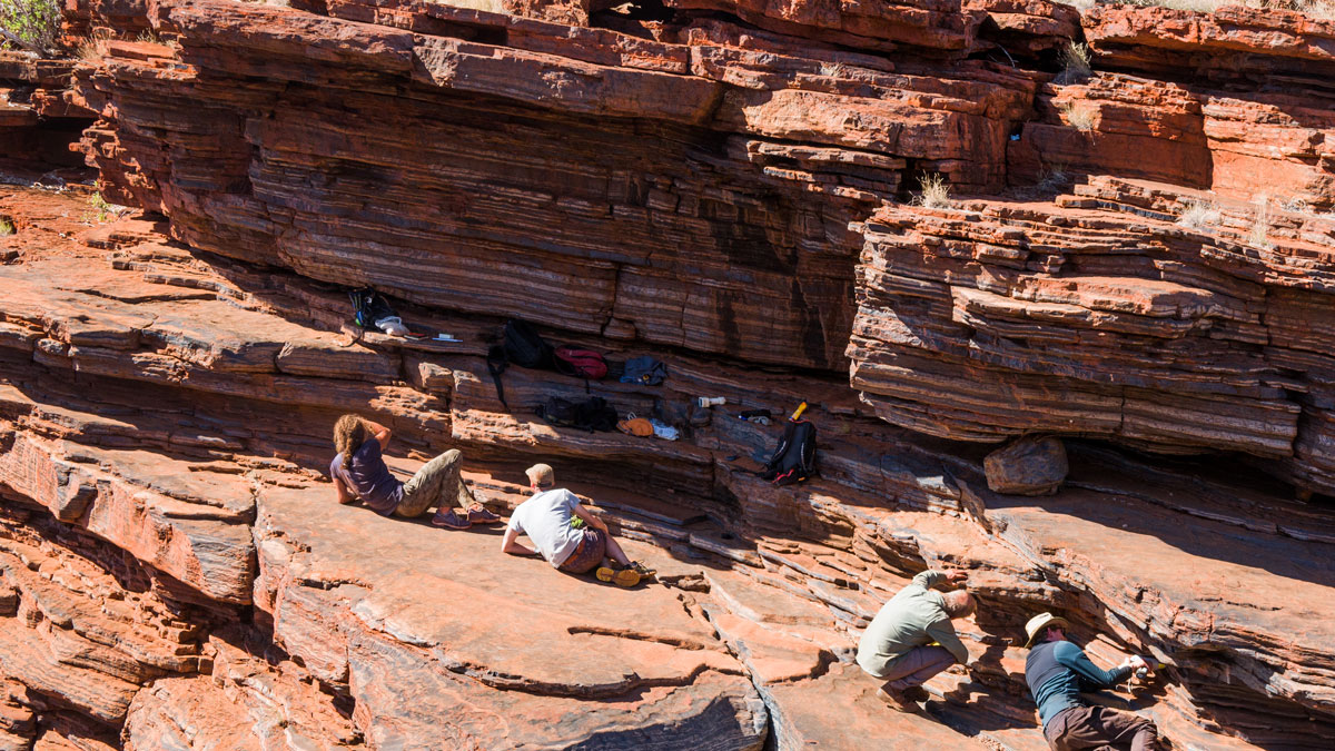 Researchers study banded iron formations in Karijini National Park, Western Australia.