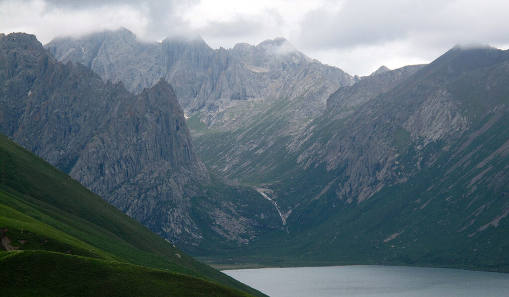 View of a lake surrounded by tall mountains