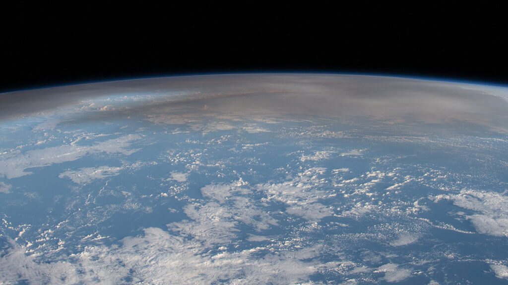 Satellite image of Earth showing the atmospheric plume blanketing the Pacific after the underwater eruption of Hunga Tonga–Hunga Ha‘apai