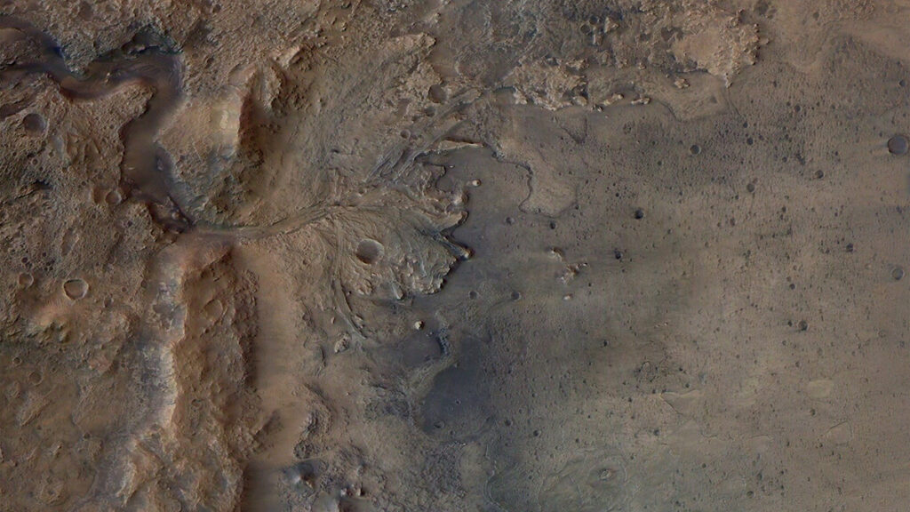 Satellite photo of a brown and gray landscape with hills and bumps