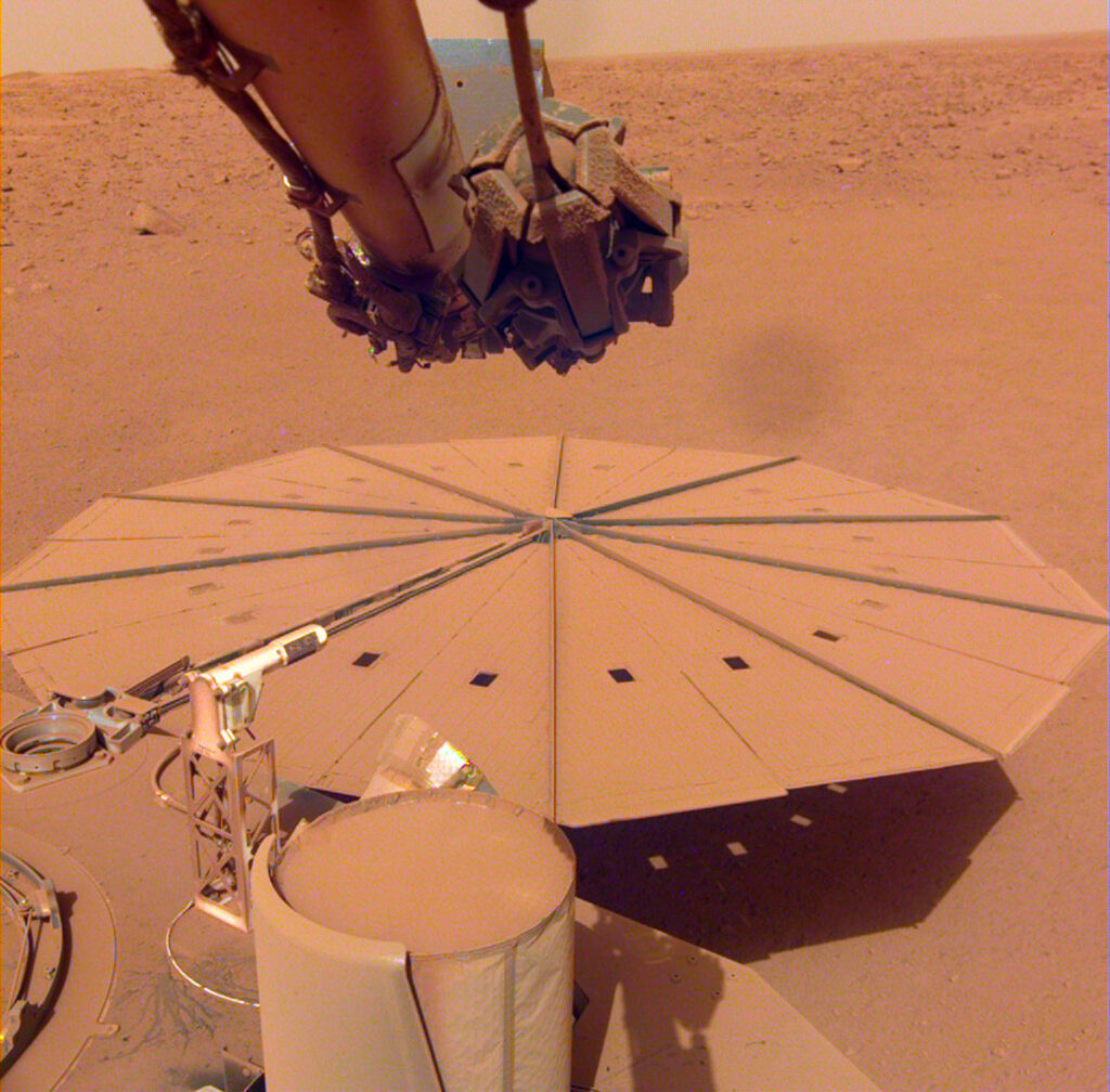 Photo of one of the InSight lander’s solar panels on Mars covered with dust.