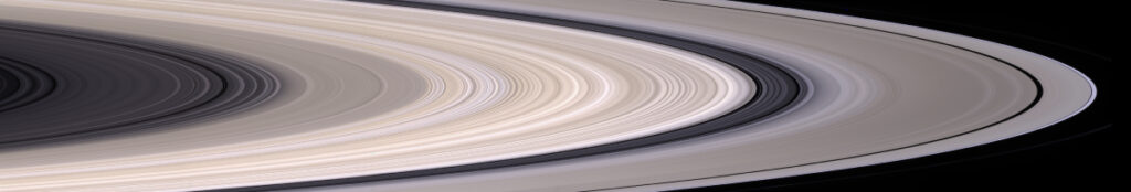 An image of a section of rings in shades of beige with crisp edges. The rings toward the left (closer to the planet) and toward the right (away from the planet) are darker and more spaced out than the rings in the middle.