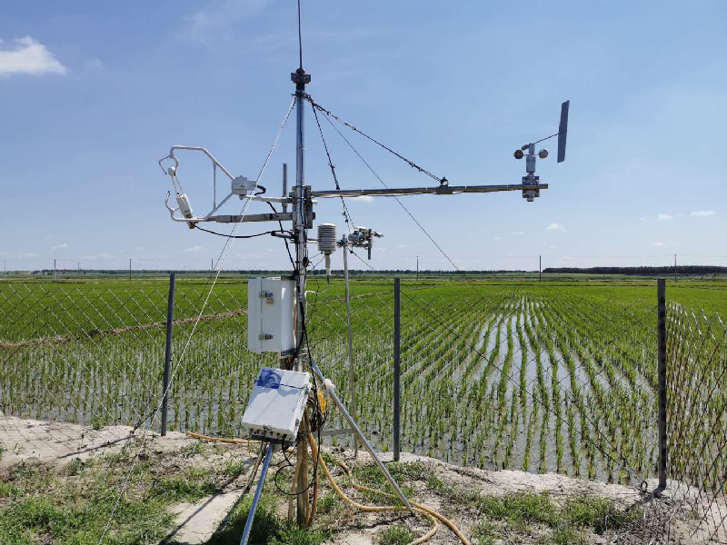 A metal instrument sits next to a field.