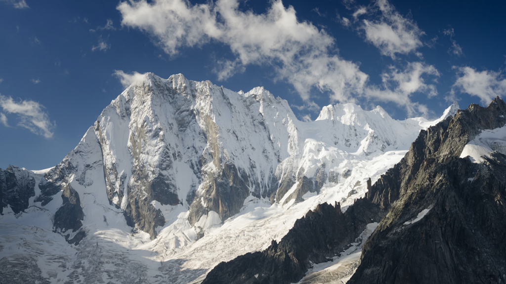 Photo of a snow covered mountain
