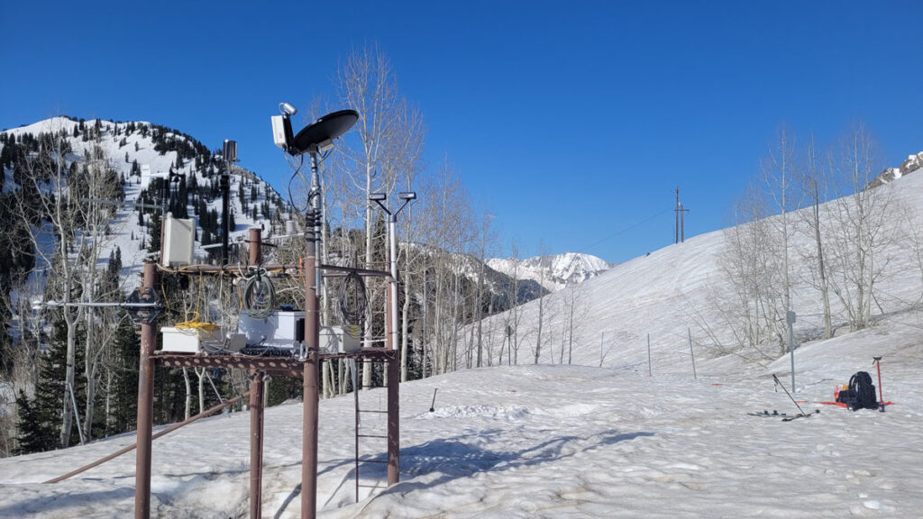 Brown dust darkens large areas of snow.